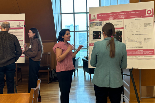 Poster Session 2025 showing two students with posters